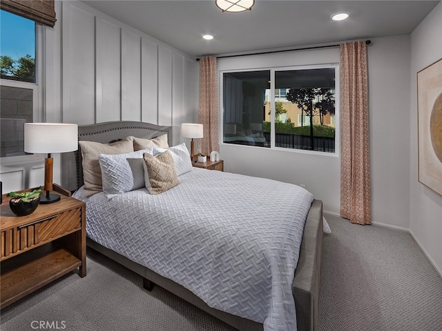 carpeted bedroom with recessed lighting and baseboards