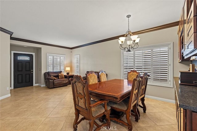 dining space featuring a chandelier, crown molding, light tile patterned flooring, and baseboards