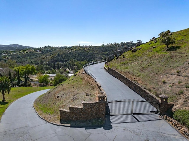 surrounding community featuring a gate and fence