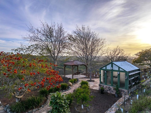 view of property's community featuring an outbuilding, an exterior structure, and a gazebo