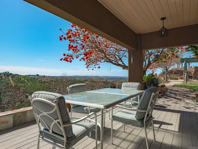 wooden deck with outdoor dining area