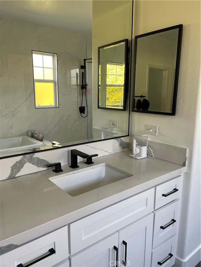 full bath featuring a shower, a bathtub, and vanity