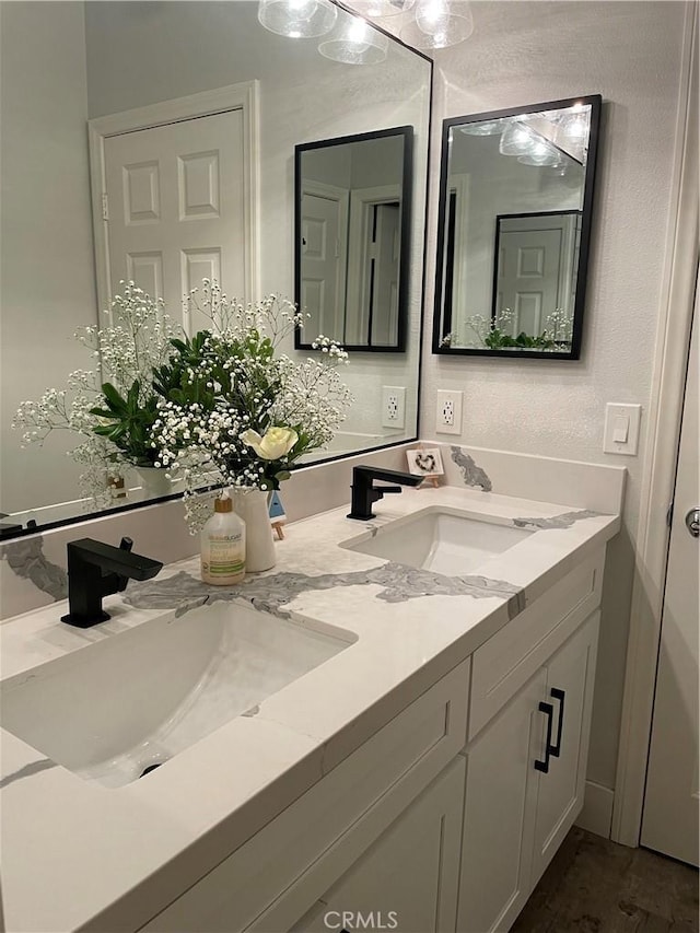 bathroom featuring double vanity and a sink