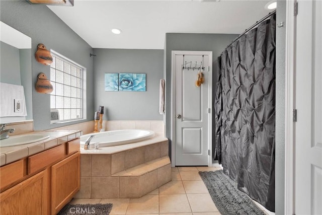 bathroom featuring a shower with shower curtain, vanity, a bath, and tile patterned floors