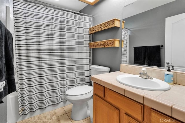 full bathroom featuring shower / tub combo with curtain, vanity, toilet, and tile patterned floors