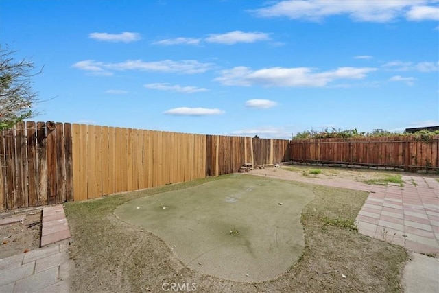 view of yard featuring a fenced backyard and a patio