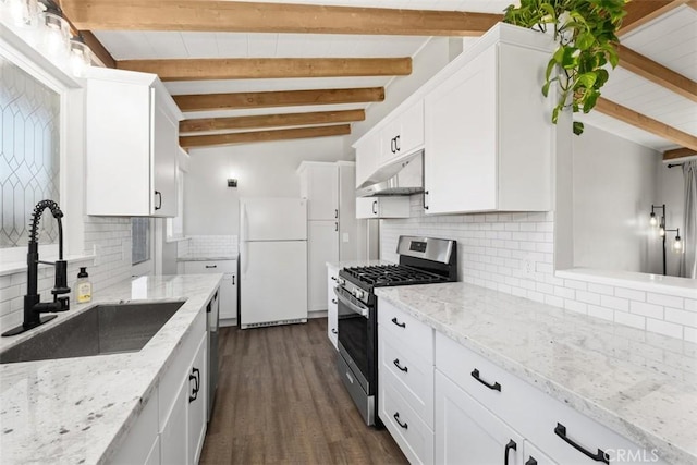 kitchen featuring white cabinets, under cabinet range hood, stainless steel appliances, and a sink