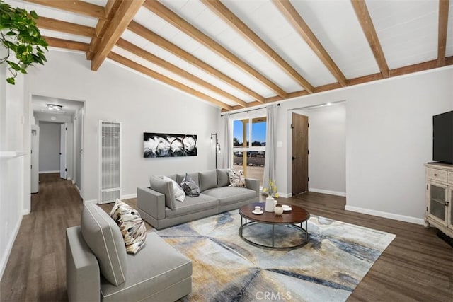 living area with vaulted ceiling with beams, wood finished floors, and baseboards