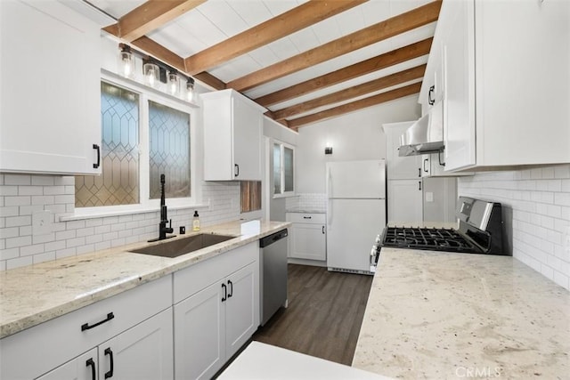 kitchen featuring white cabinets, decorative backsplash, stainless steel appliances, wall chimney range hood, and a sink