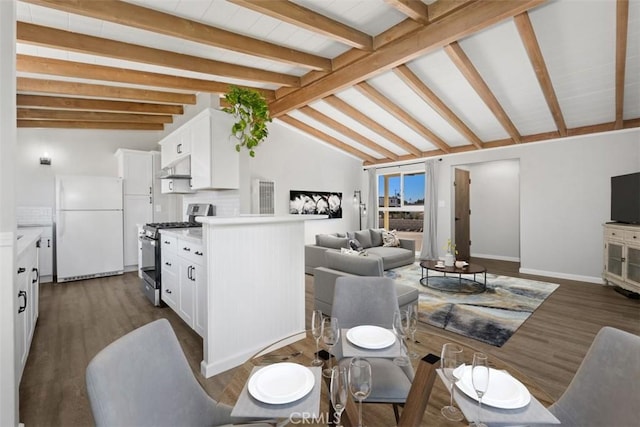 dining area featuring lofted ceiling with beams and dark wood finished floors