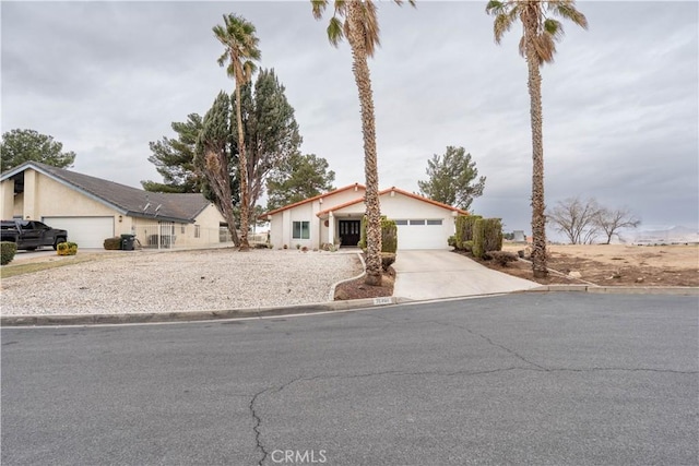 view of front of home featuring a garage and driveway