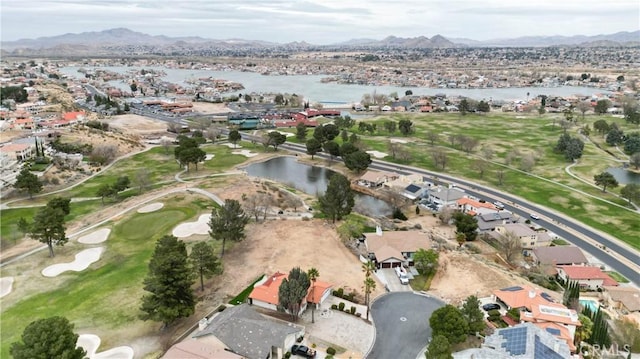 bird's eye view featuring a residential view, view of golf course, and a water and mountain view