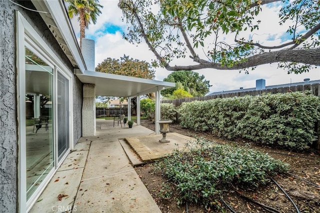 view of yard featuring a patio and a fenced backyard