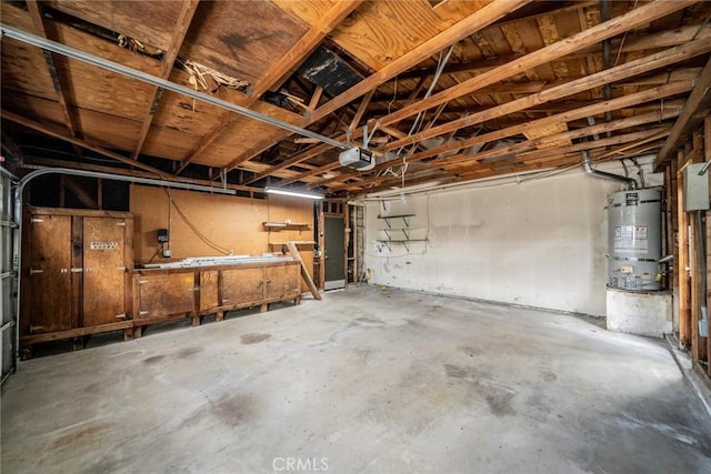 garage featuring secured water heater and a garage door opener