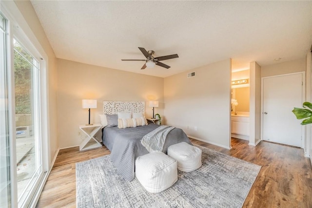 bedroom with visible vents, baseboards, access to exterior, and light wood finished floors