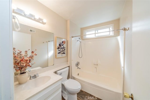 full bath with visible vents, toilet, shower / bath combination, and vanity