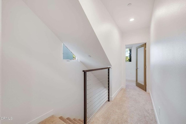 corridor featuring recessed lighting, carpet, an upstairs landing, and baseboards