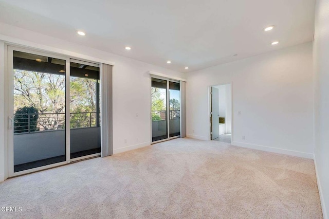 carpeted spare room with recessed lighting and baseboards