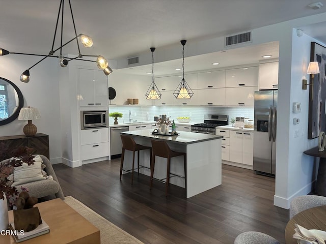239 S Marengo Ave Unit 112, Pasadena, CA 91101 - kitchen with appliances with stainless steel finishes, modern cabinets, white cabinets, and recessed lighting