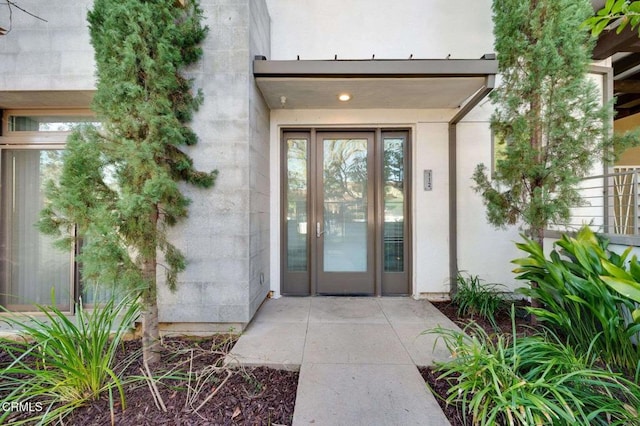 239 S Marengo Ave Unit 112, Pasadena, CA 91101 - doorway to property featuring stucco siding