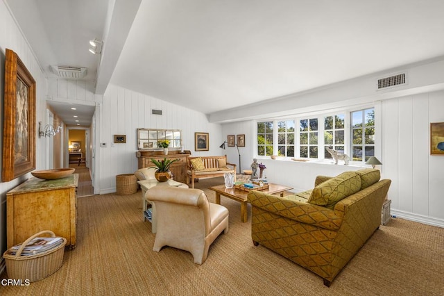 living area with lofted ceiling and visible vents