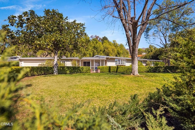 exterior space with a front lawn