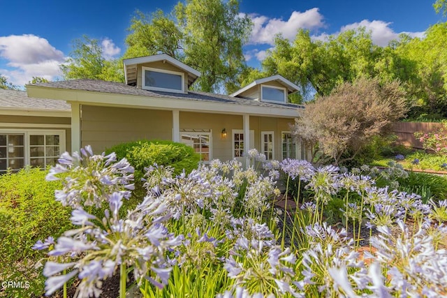 view of front of house featuring fence