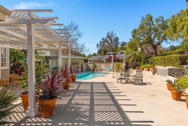 view of patio with a fenced in pool, fence, and a pergola