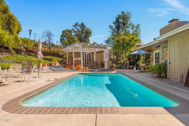 pool featuring a patio area and a pergola