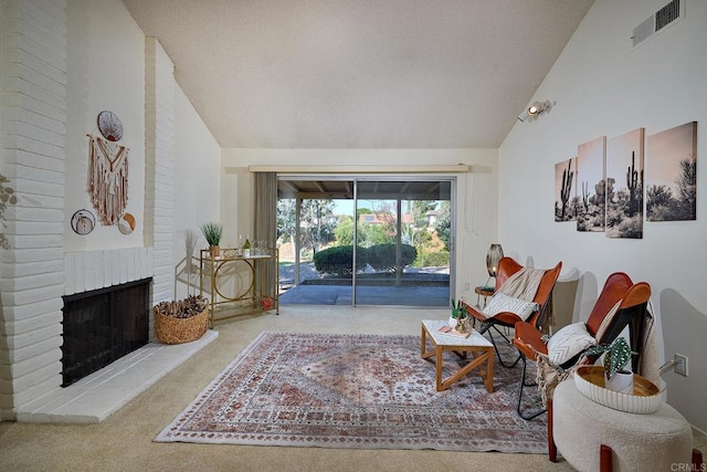 living room featuring carpet, high vaulted ceiling, a brick fireplace, and visible vents