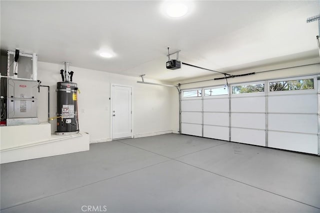 garage featuring water heater, baseboards, heating unit, and a garage door opener