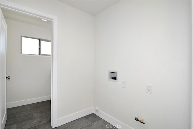 clothes washing area with hookup for a washing machine, hookup for a gas dryer, laundry area, and baseboards