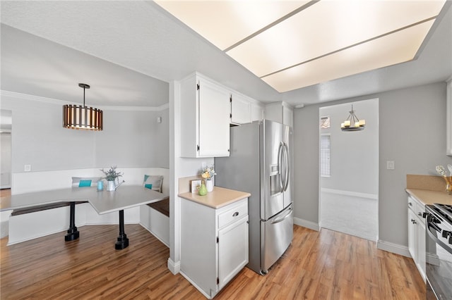 40115 Starling St, Temecula, CA 92591 - kitchen with stainless steel refrigerator with ice dispenser, light wood-type flooring, a chandelier, white cabinetry, and light countertops