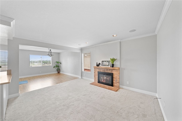 40115 Starling St, Temecula, CA 92591 - living room with carpet floors, ornamental molding, a fireplace with flush hearth, a chandelier, and recessed lighting