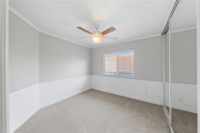40115 Starling St, Temecula, CA 92591 - empty room featuring carpet flooring, ceiling fan, ornamental molding, and wainscoting