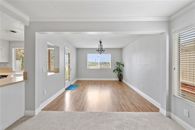40115 Starling St, Temecula, CA 92591 - unfurnished dining area featuring crown molding and wood finished floors