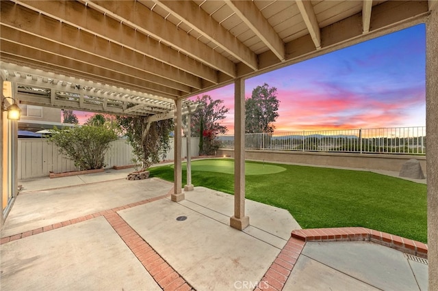 40115 Starling St, Temecula, CA 92591 - patio terrace at dusk with a patio, a pergola, and an area to practice putting