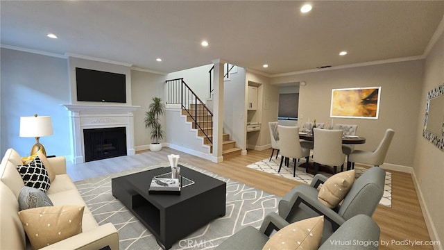 living area with light wood finished floors, stairway, and recessed lighting