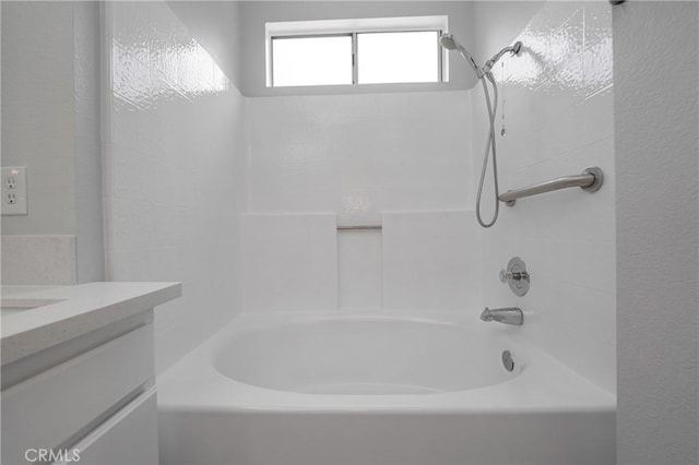 bathroom featuring vanity and shower / tub combination