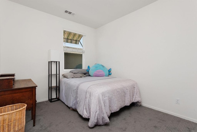 bedroom with carpet floors, visible vents, and baseboards