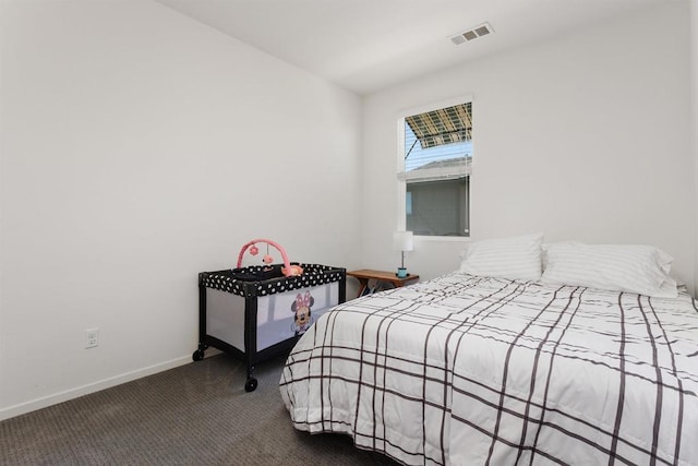 bedroom featuring carpet, visible vents, and baseboards