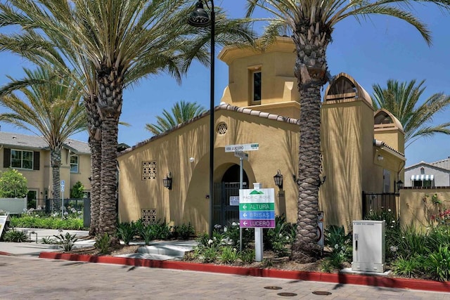 view of building exterior with fence