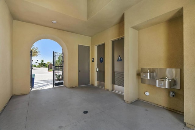 view of patio with a gate