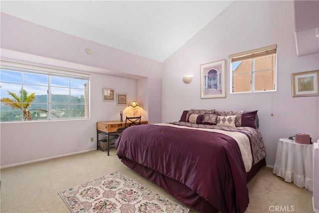 bedroom with carpet flooring, vaulted ceiling, and baseboards