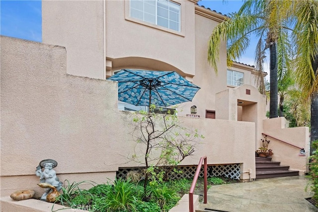 exterior space featuring stucco siding