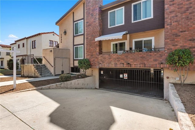 view of property with concrete driveway