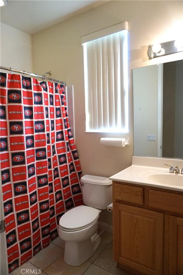 full bathroom featuring vanity, curtained shower, tile patterned flooring, and toilet