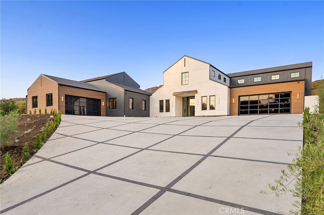 view of front of home featuring driveway and an attached garage