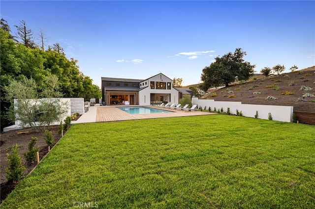 view of yard featuring a fenced in pool, a patio area, and fence