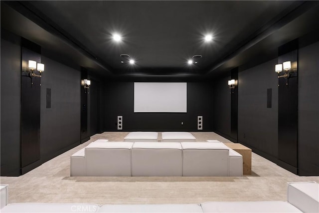 home theater featuring a tray ceiling and recessed lighting